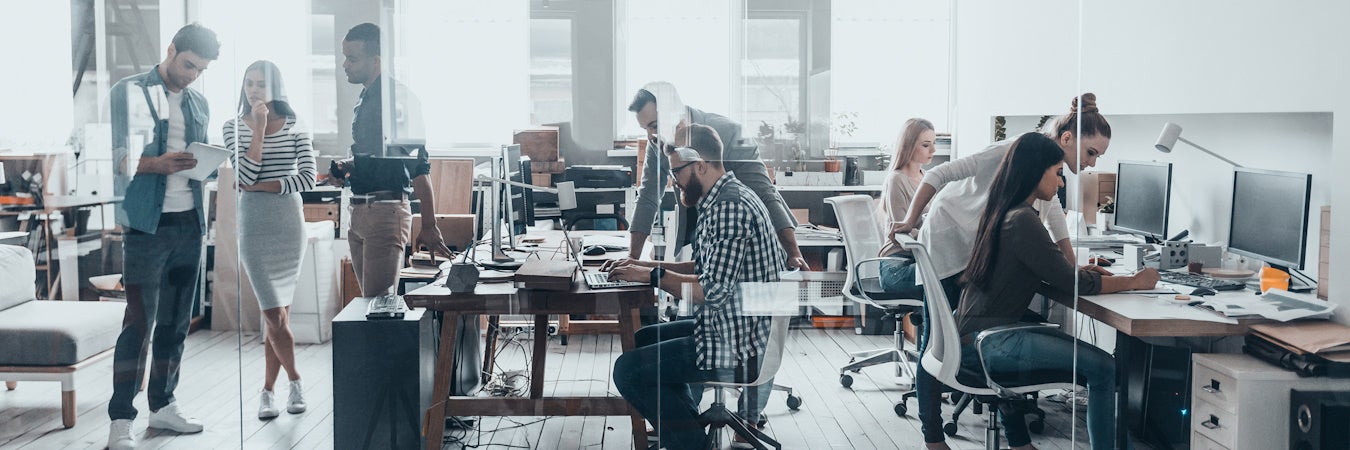 Crowded office full of employees